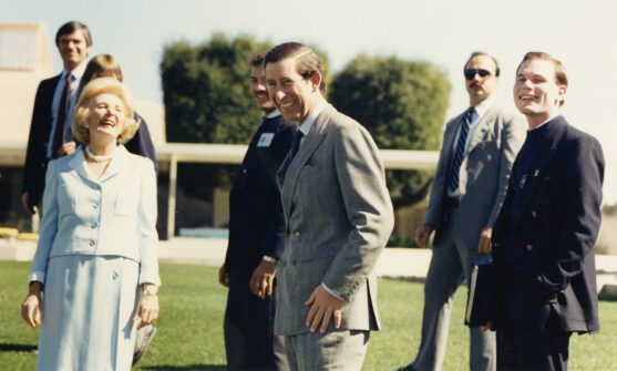 Photo from 1982 of Prince Charles at Sunnylands with Leonore Annenberg and several others in the background on the lower terrace at Sunnylands
