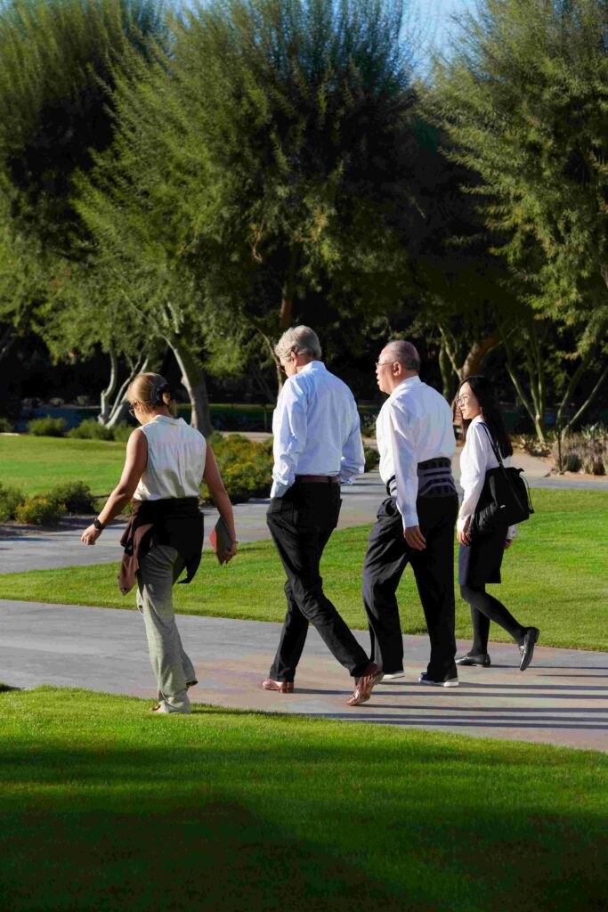 Former Secretary of State John Kerry, the U.S. Special Presidential Envoy for Climate, and his counterpart from China, Minister Xie Zhenhua, walk with interpreters at Sunnylands Center & Gardens.