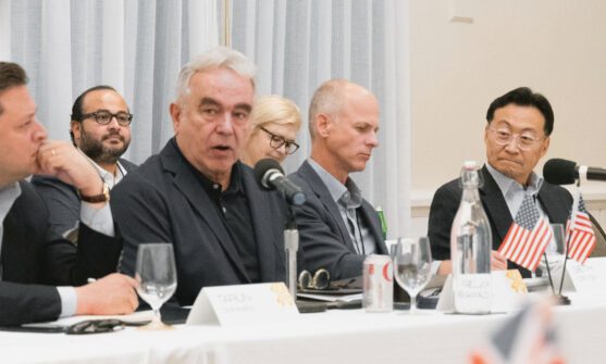 Various meeting participants in discussion